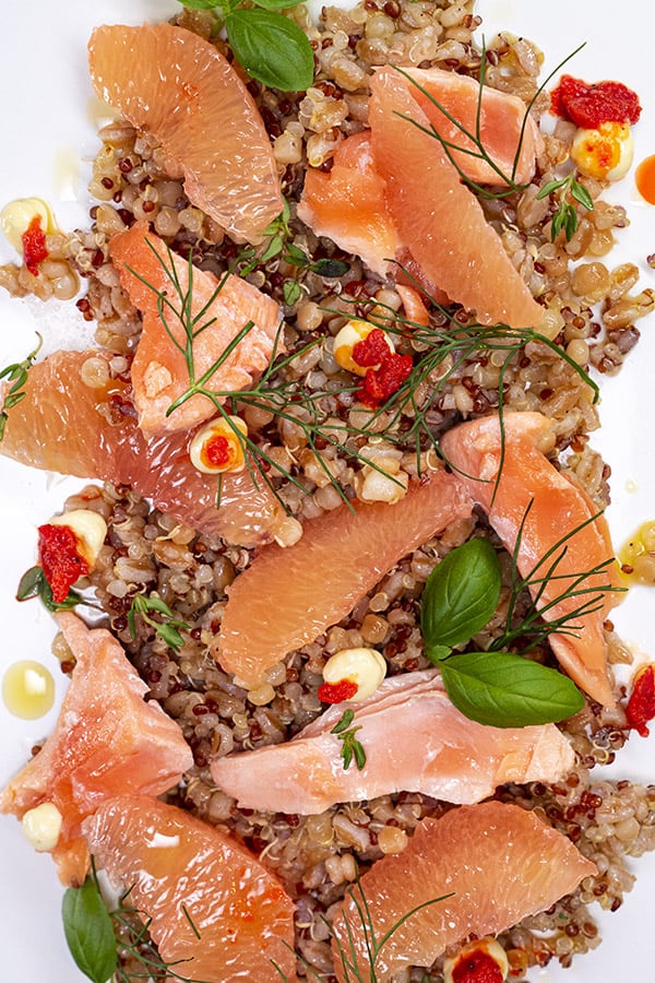 Close Up Poached Salmon, Grapefruit, Grains, and Chile